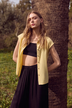 SLEEVELESS SHIRT WITH BEJEWELED BUTTONS