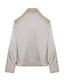 BLOUSE WITH A DRAPED NECKLINE AND RHINESTONES
