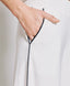 PANTS WITH AN ELASTIC WAIST AND PIPING DETAILS