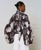 FLORAL BLOUSE WITH A TIE NECKLINE